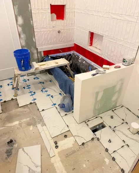 Precision shower waterproofing and tile floor installation by Mims Construction in Hamilton County