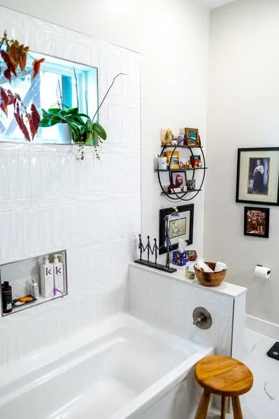 Completed luxury bathroom remodel with tile floor custom tub combo and hung barn door by Mims Construction