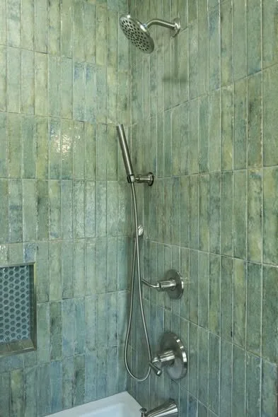 Close up of custom shower tile layout and transition detail by Mims Construction in luxury Riverview bathroom
