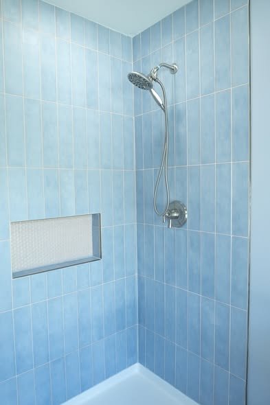 Close up of custom shower tile layout and transition detail by Mims Construction in luxury Riverview bathroom