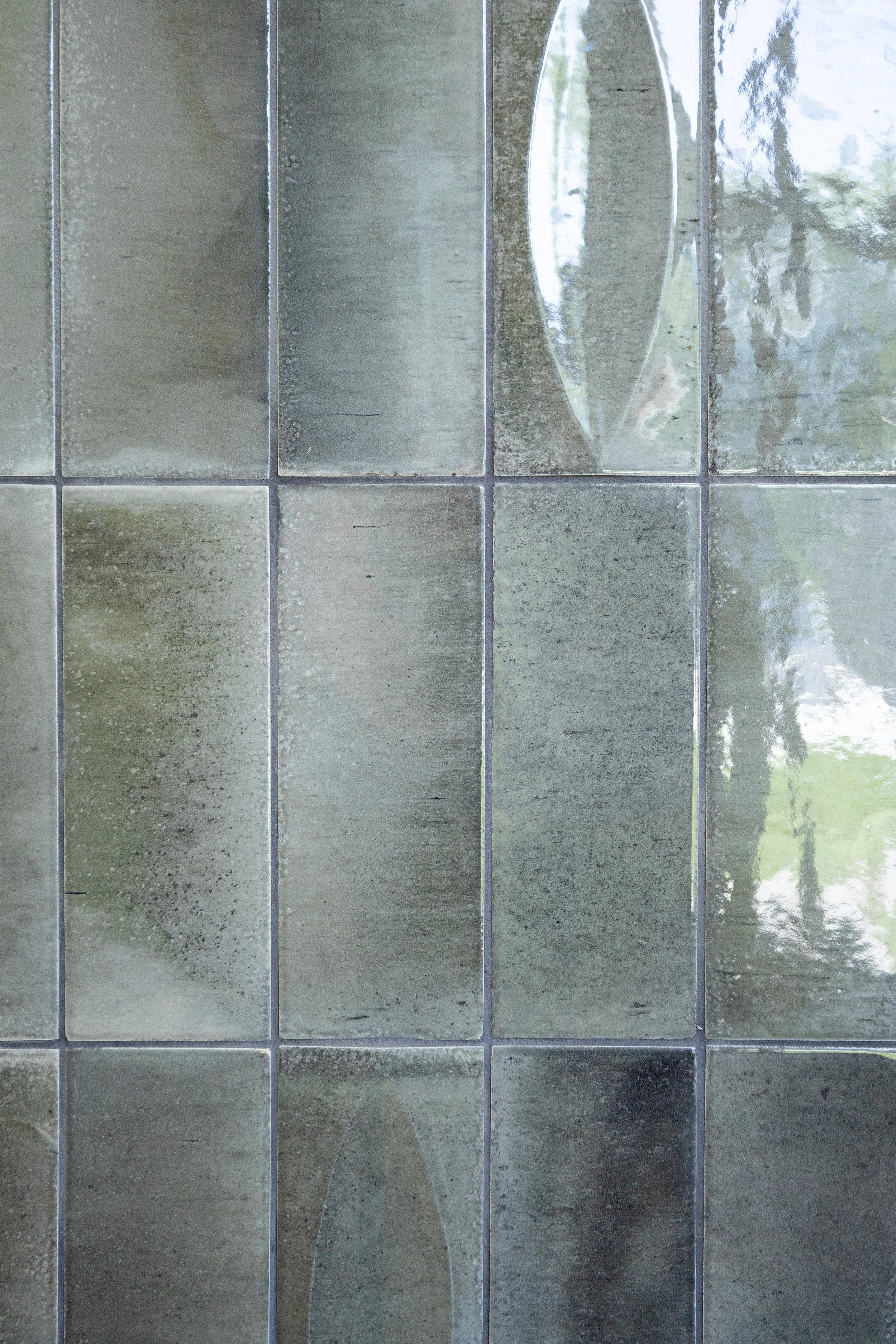 Close up of custom shower tile layout and transition detail by Mims Construction in luxury Riverview bathroom