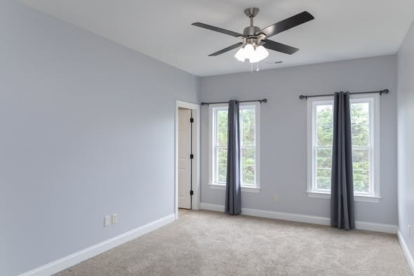 Completed pre-sale home refresh featuring updated lighting painted cabinets and refinished flooring by Mims Construction