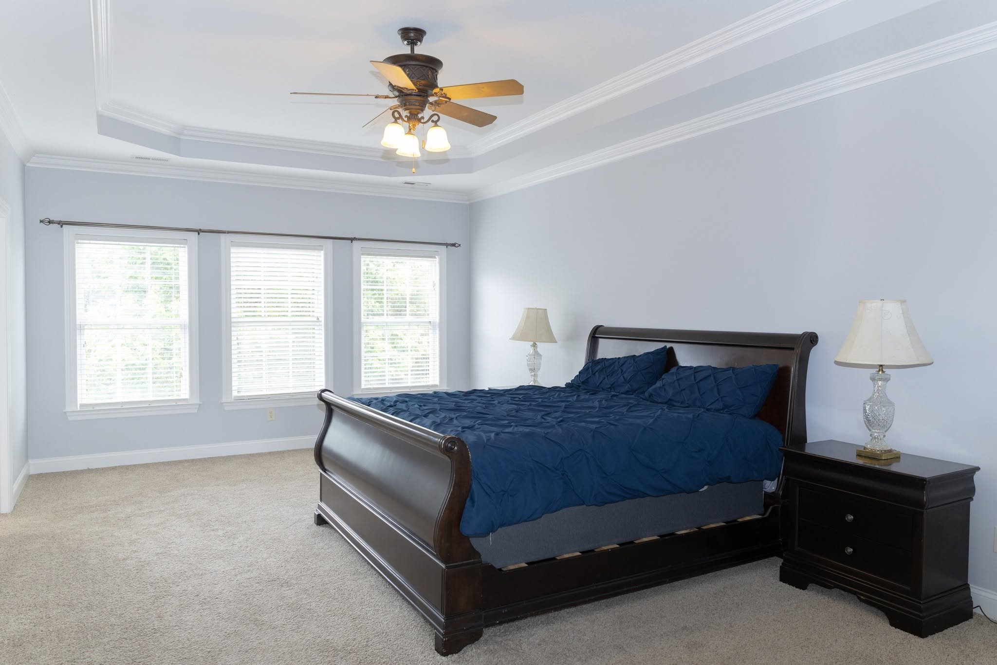 Completed pre-sale home refresh featuring updated lighting painted cabinets and refinished flooring by Mims Construction