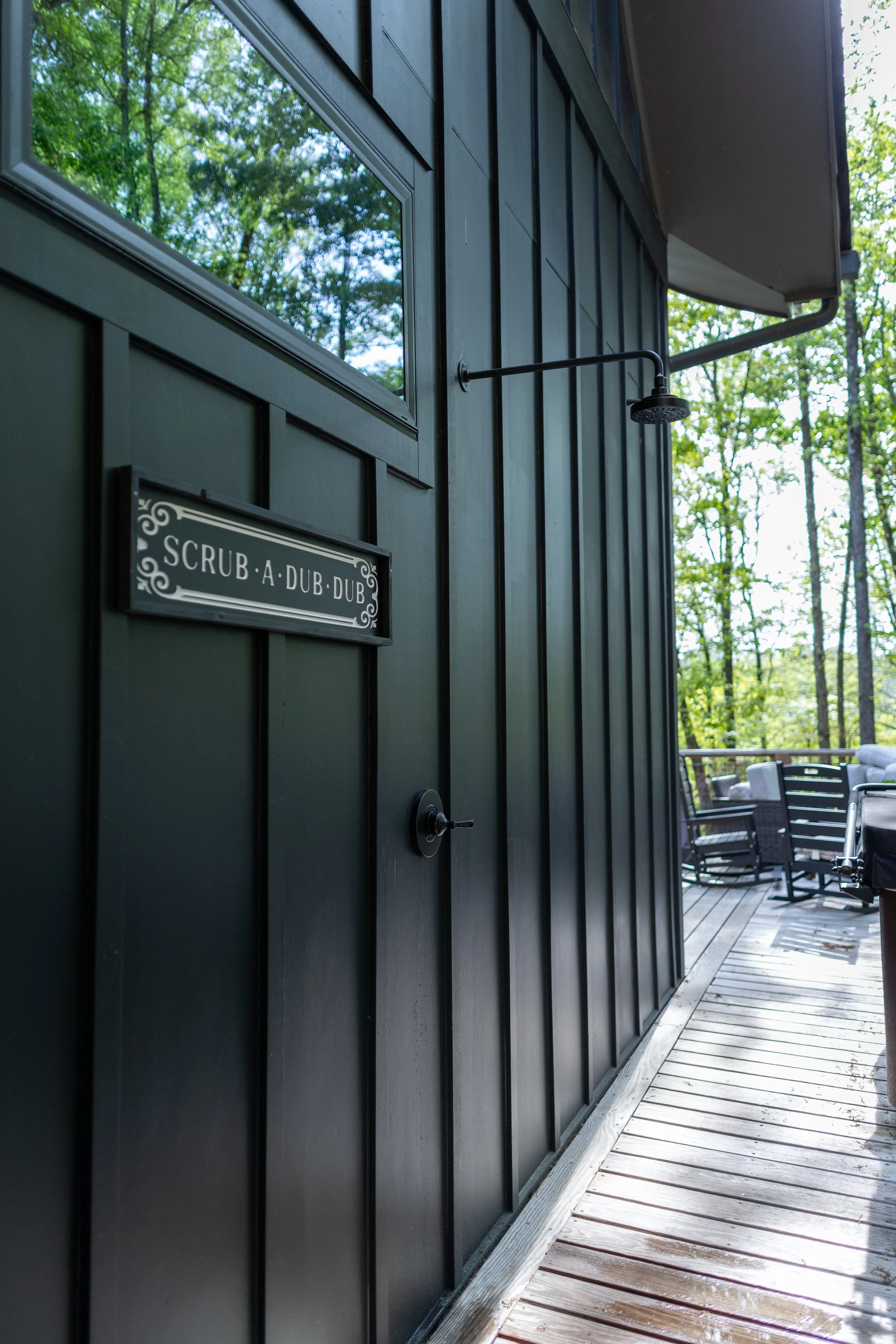 Custom outdoor shower seamlessly integrated into existing residential siding by Mims Construction in North Shore Riverview Chattanooga, custom engineered with a master bath remodel that  remedied plumbing failures and underlying water damage.