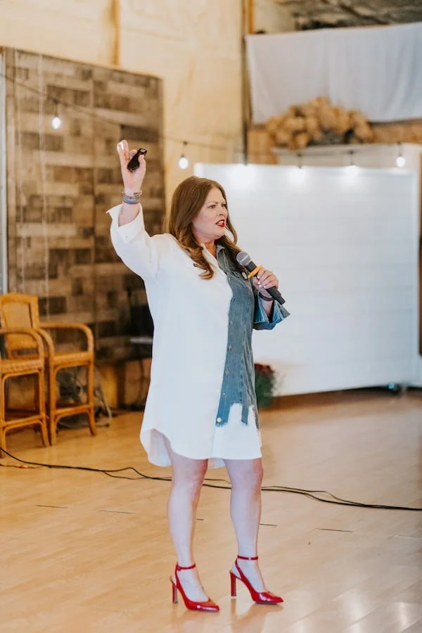 Angela Drake speaking on stage