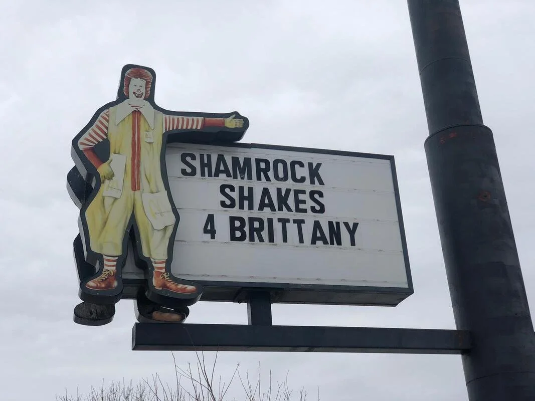 A sign that says "shamrock shakes for 4 Brittany"