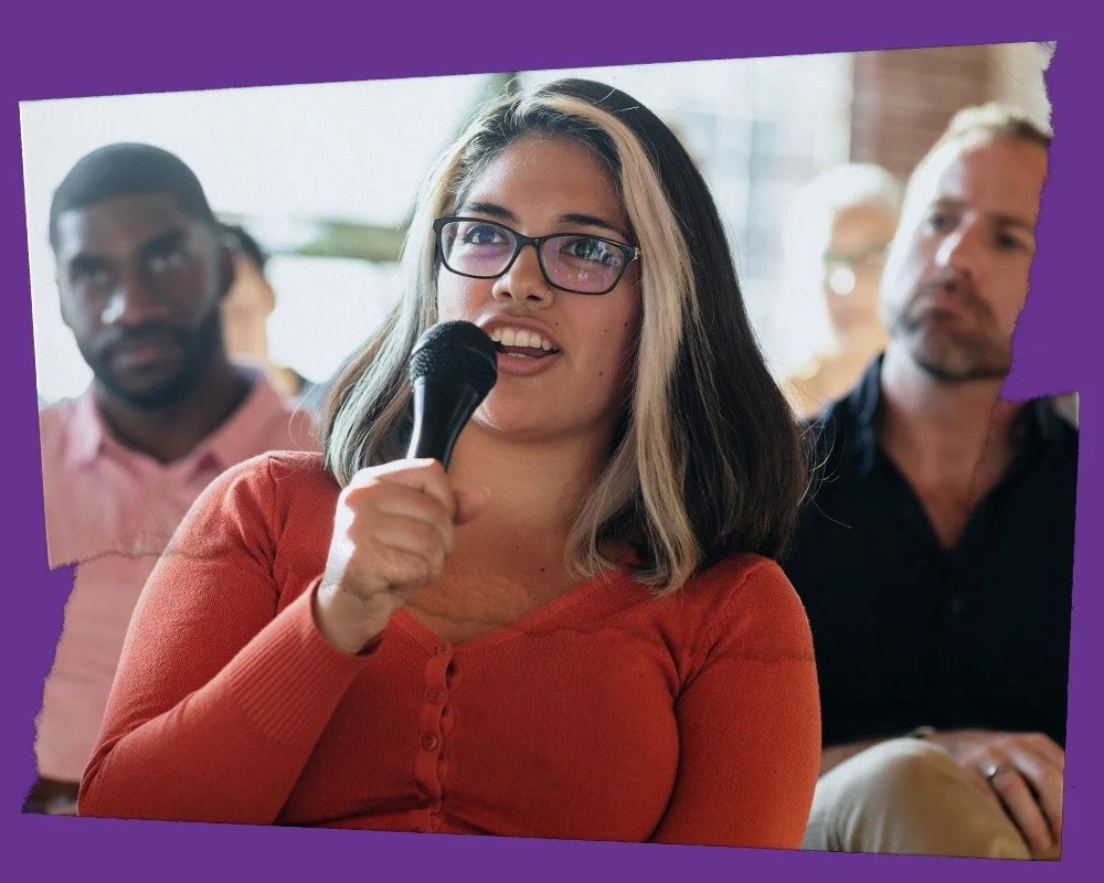 A woman speaking in a microphone