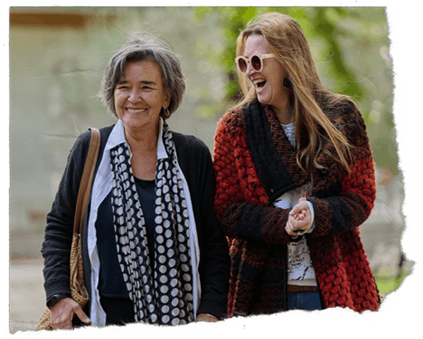 Two ladies laughing together