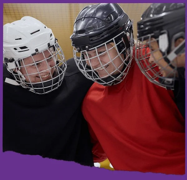 3 hockey players smiling together