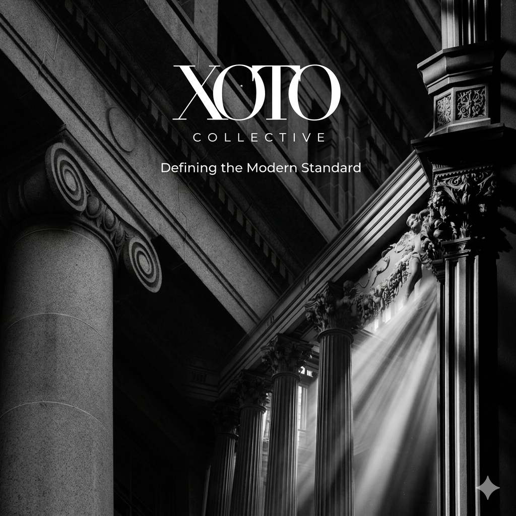 Black and white interior of a grand building with classical columns and ornate architectural details, with sunlight streaming through windows.