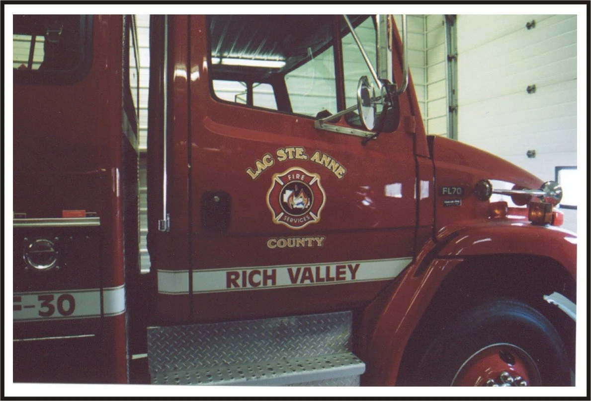 Fire truck inside a fire station garage.