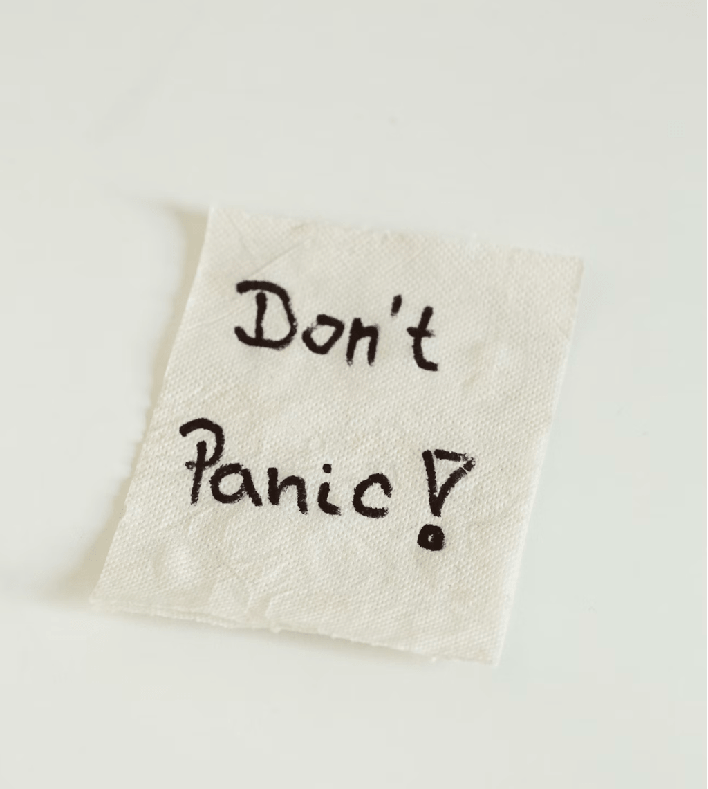 Don't Panic written on a napkin, brainstorming business ideas and fixes in a coffee shop. Business Ideas by Heather