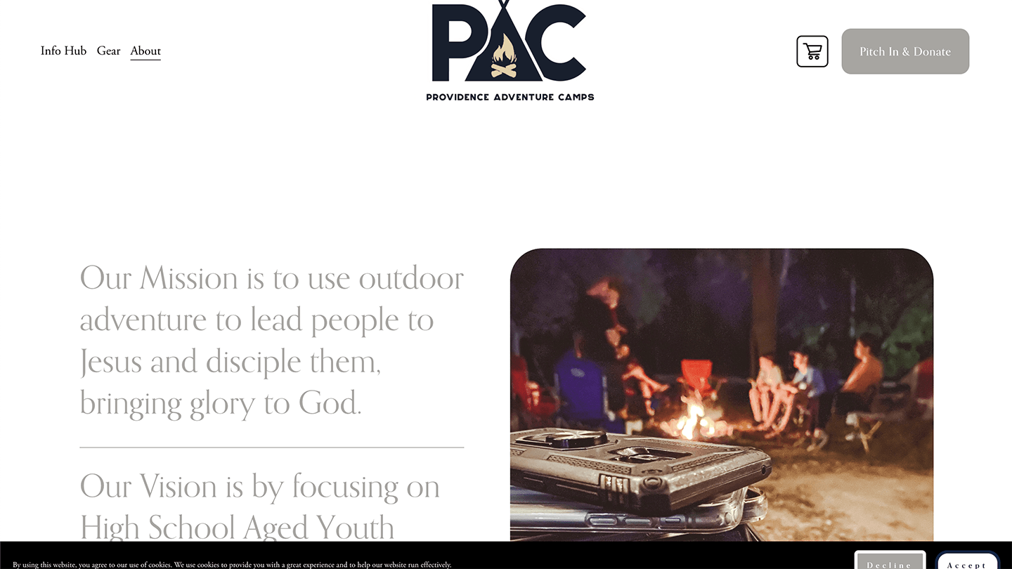 Campfire circle with laughing friends, phones piled up—Providence Adventure Camps unplugged vibe. Heather's grab.