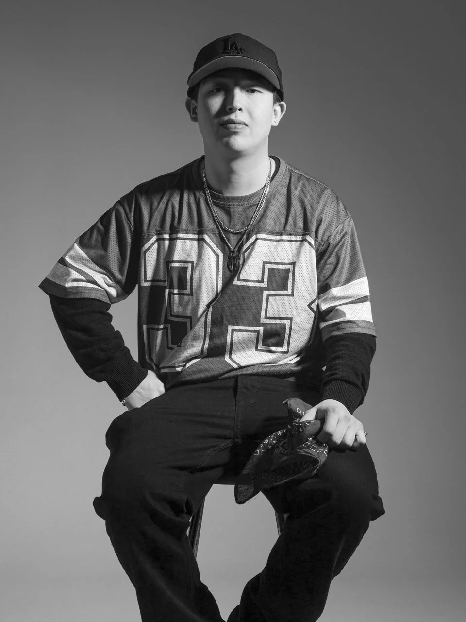 Black and white studio self-portrait of Toronto photographer Yeshua Obando.