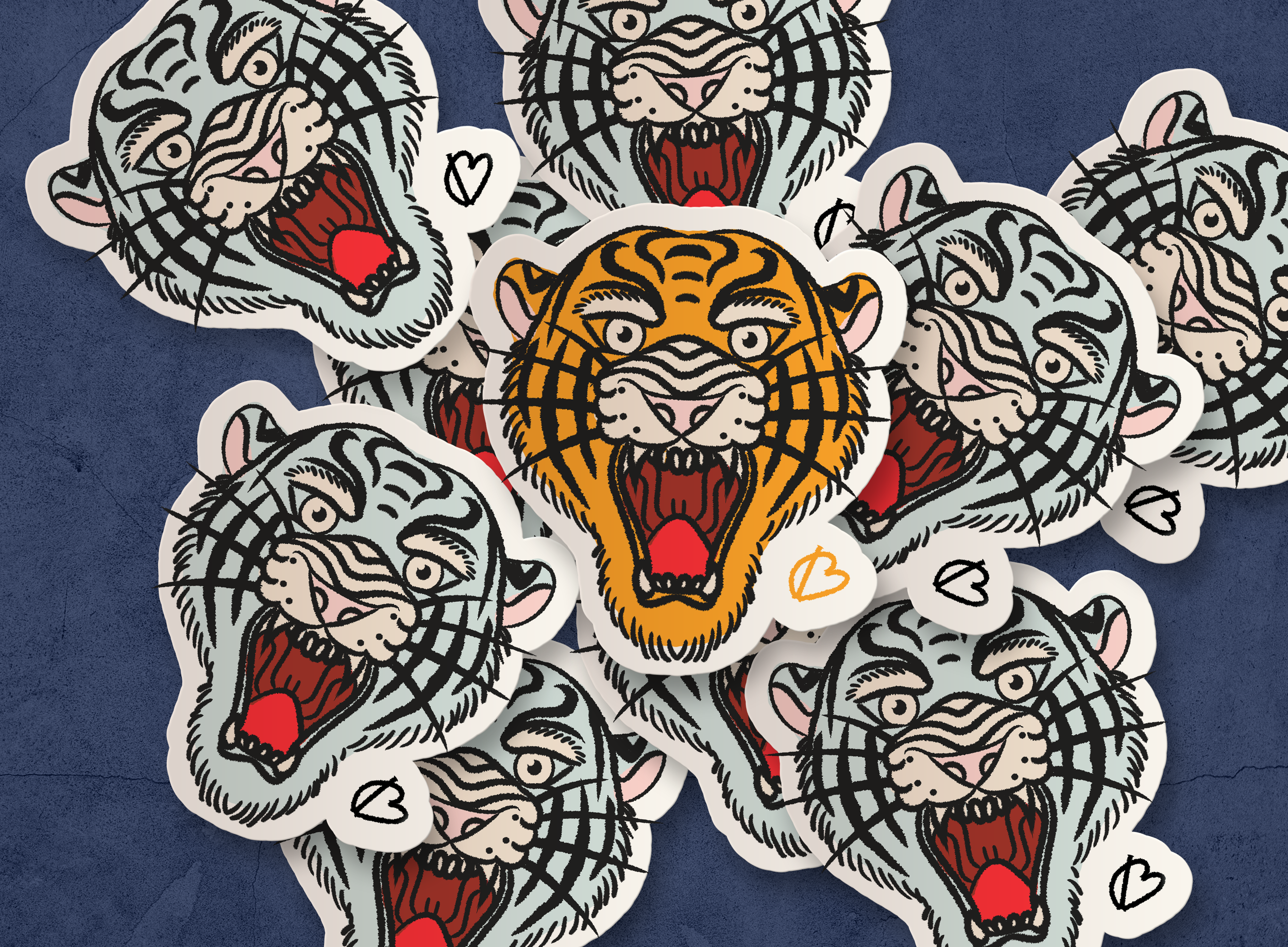 Multiple stickers of snarling tiger faces with open mouths, sharp teeth, and powerful expressions, arranged on a dark surface.