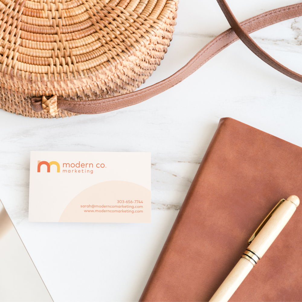 A nighttime scene in a canyon with a tent illuminated from within, under a starry sky.