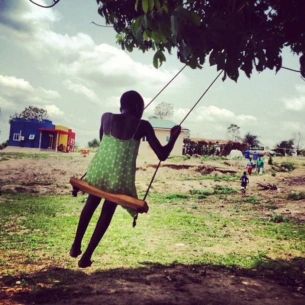 Teaching Benedicta how to swing.