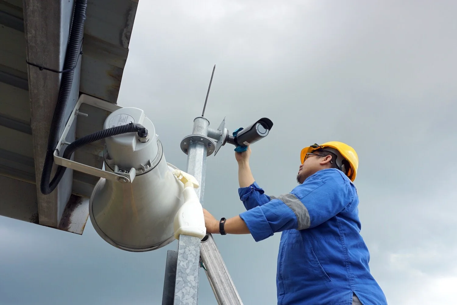 Employee installing Video Camera