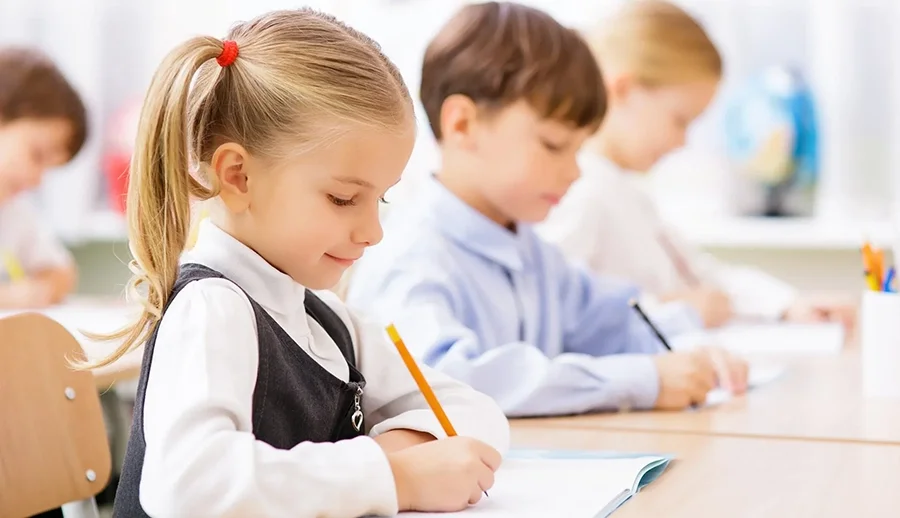 Students in a classroom supported by school communication technology