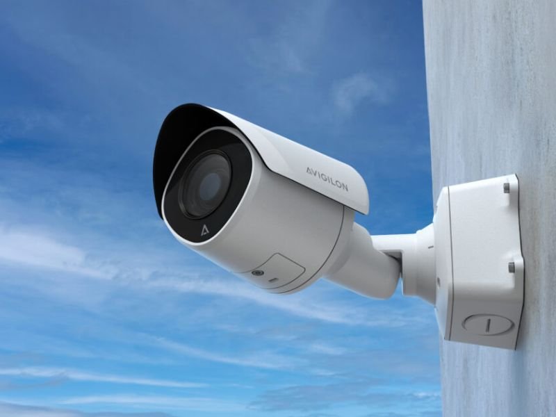 An avigilon security camera mounted on a wall on a local business in Redding