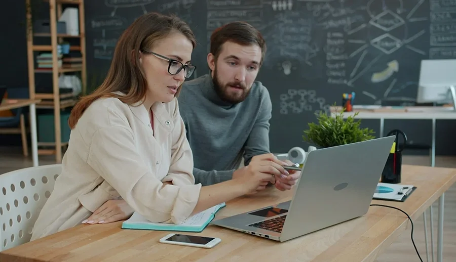 Young professionals collaborating with modern business technology