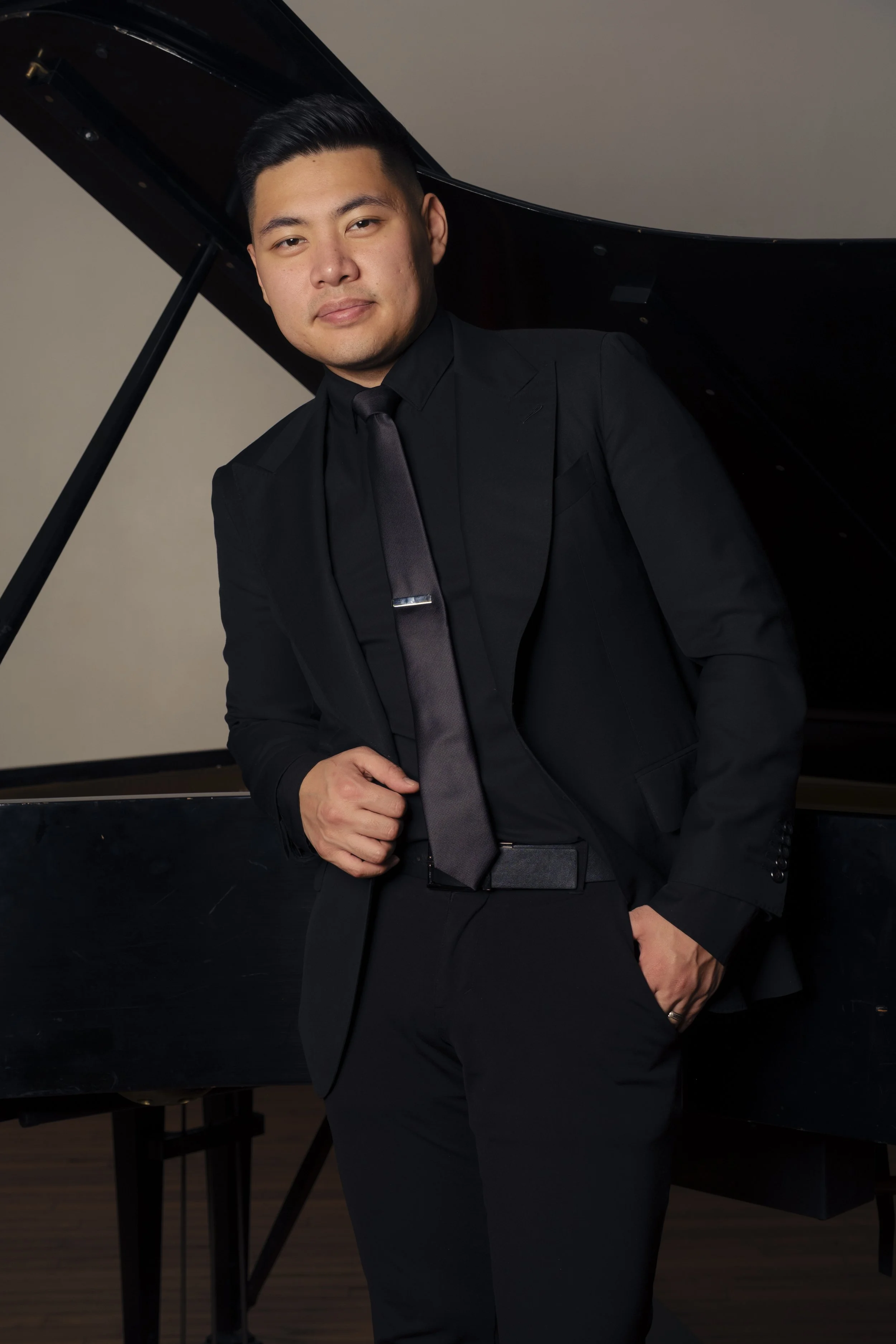 Isaac Ezekiel playing piano at a live event