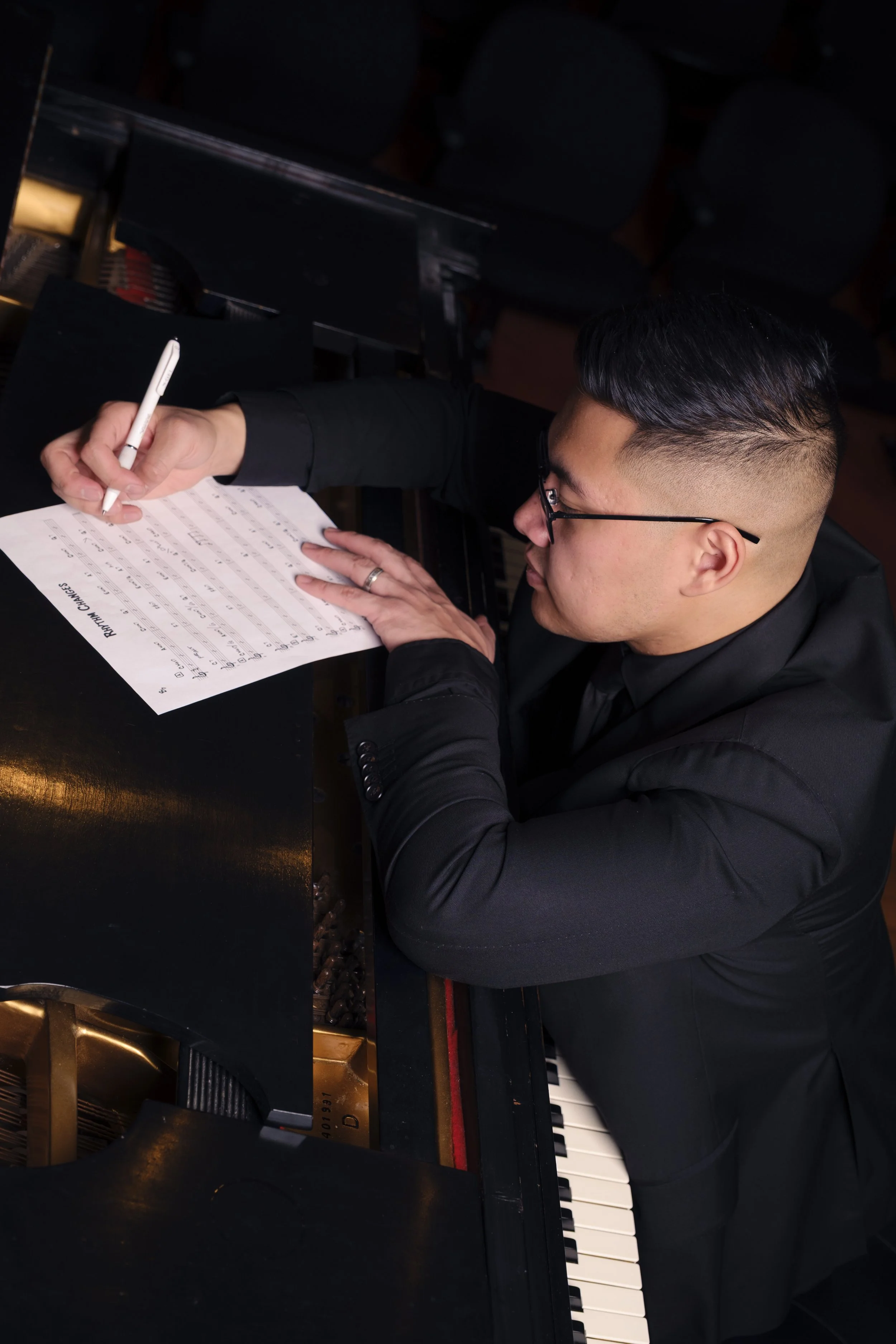 Handwritten sheet music being transcribed into a digital score