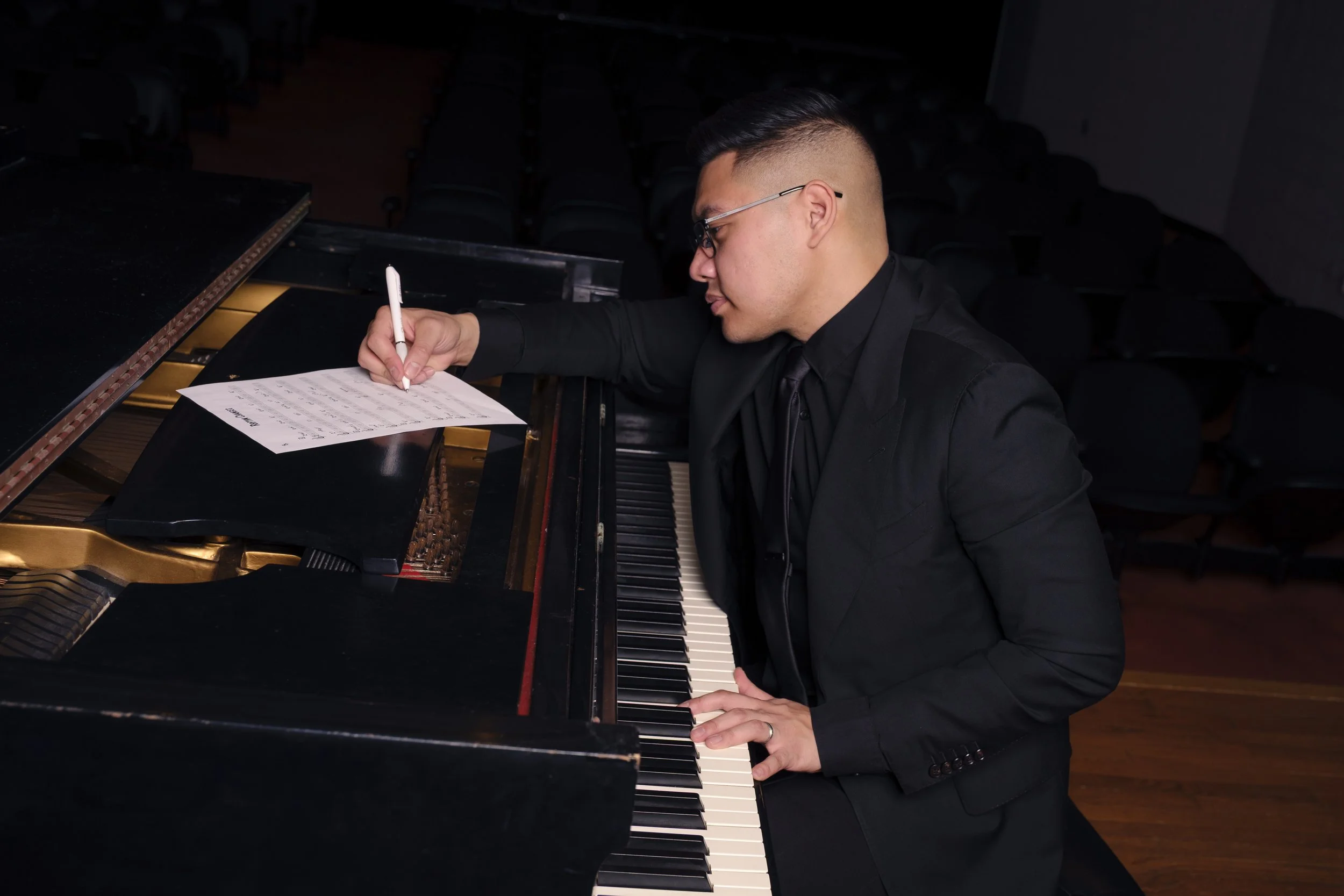 Isaac Ezekiel performing piano at a live event