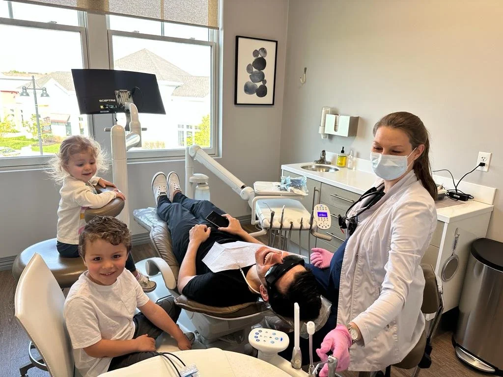 Dr. Castellucci with her family in the dental chair