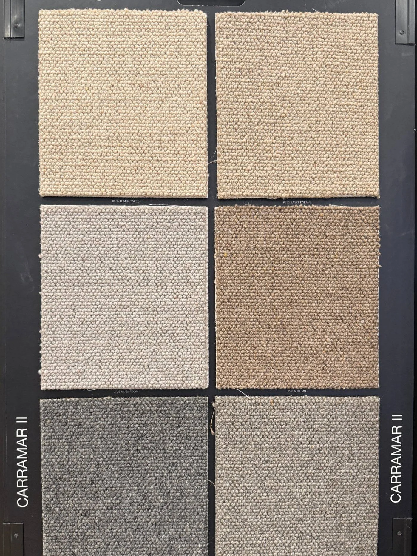 sample board of Godfrey hirst carramar II showing the different colors of beige, tan, light brown, and light, medium, and dark grey.