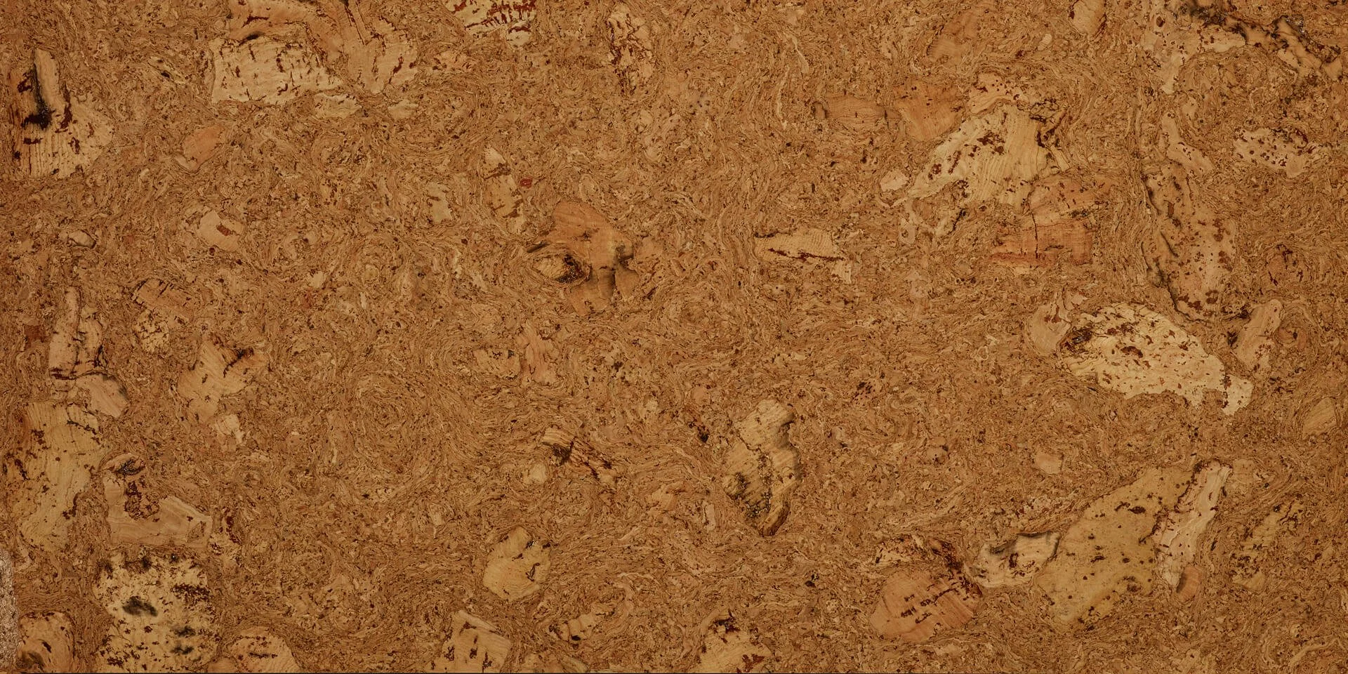 The pattern of Duro Design "Cleopatra" cork flooring. A brown and red toned granular cork with random patches.