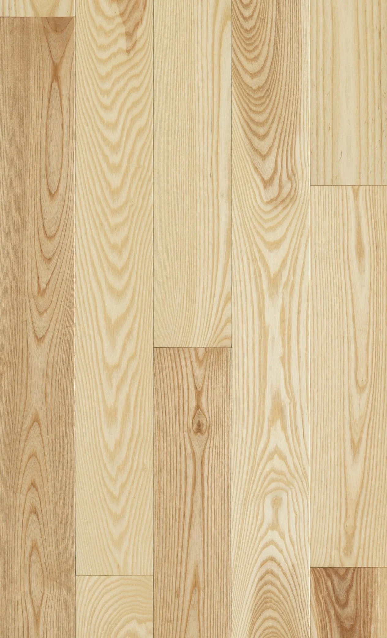 Close-up of a light-colored wooden parquet floor with multiple planks arranged in different orientations.