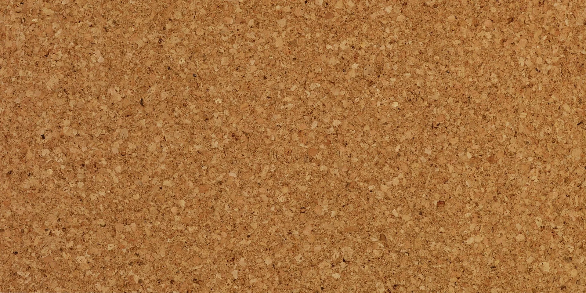 The pattern of Duro Design "Marmol" cork flooring. A brown and red toned granular cork.