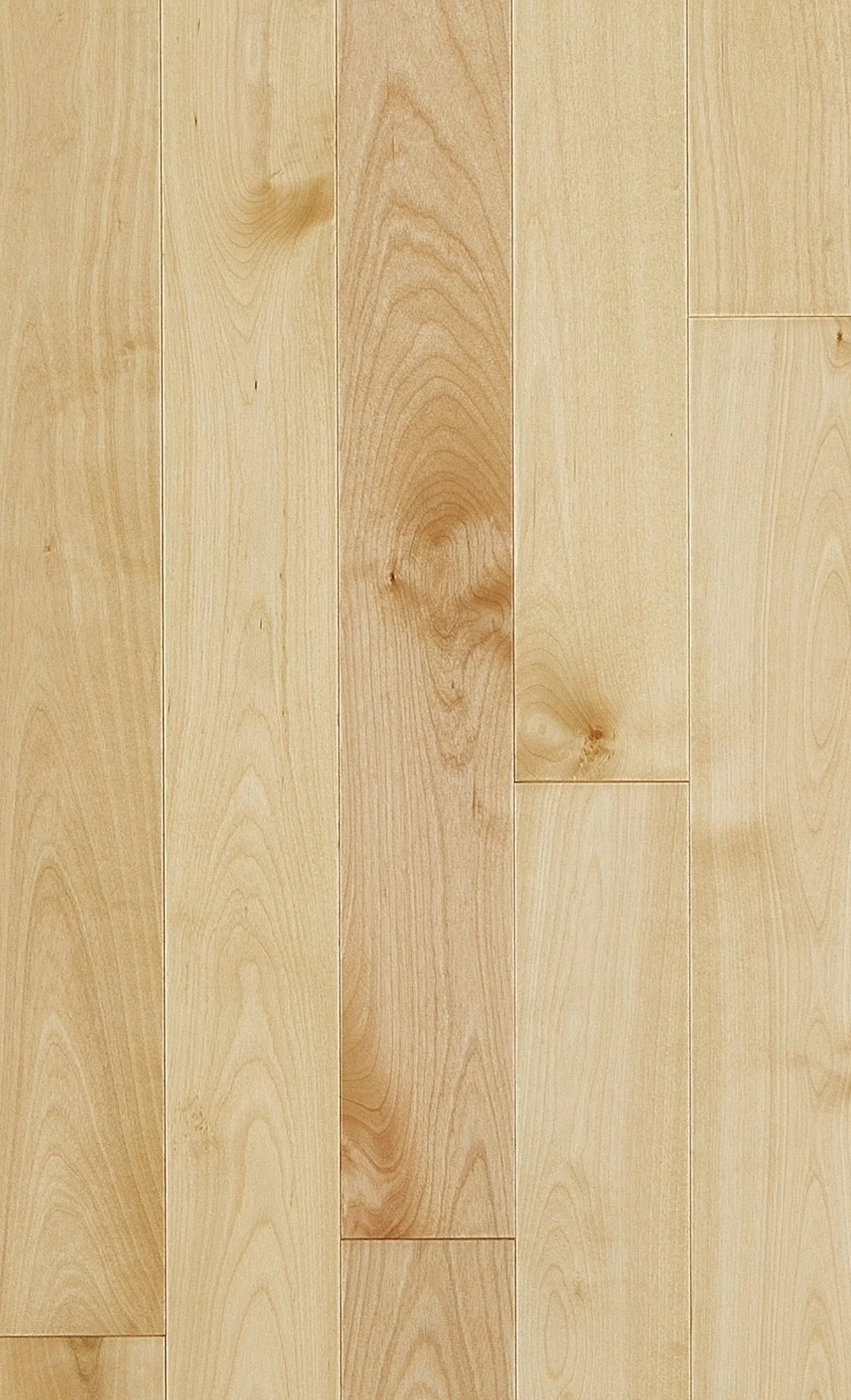 Light-colored wooden floor with vertical planks showing natural wood grain and knots.
