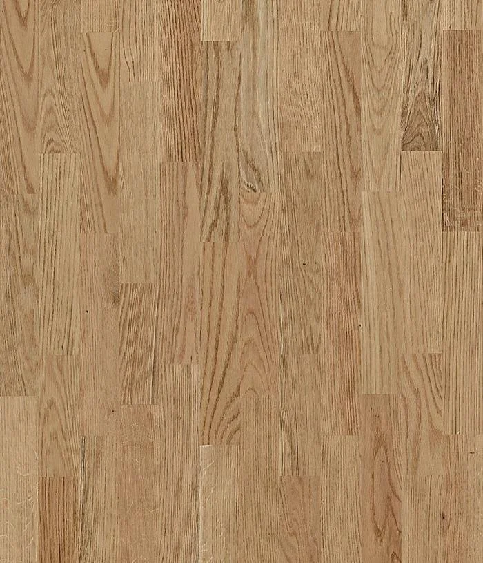 Close-up of a red oak hardwood floor with a natural light finish, showing wood grain and plank pattern.