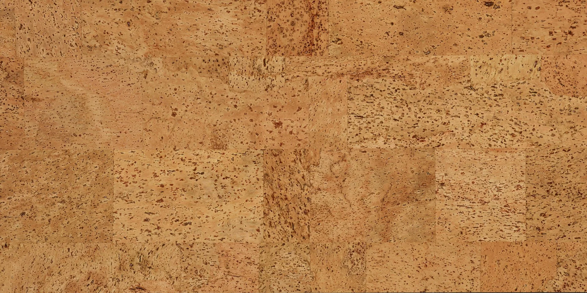 The pattern of Duro Design "Baltico" cork flooring. A brown and red toned patch style cork.