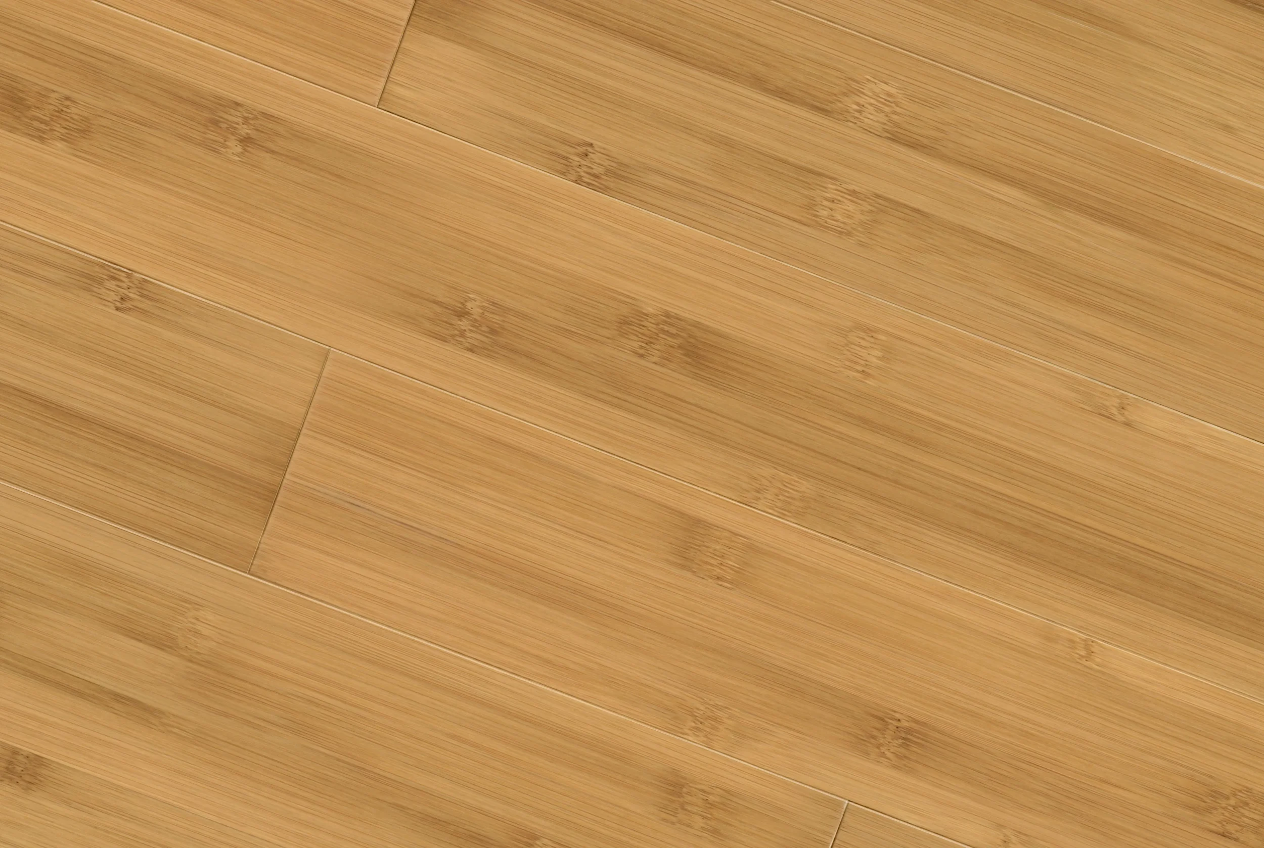 A close-up view of a wooden floor with a natural finish and visible wood grain patterns.