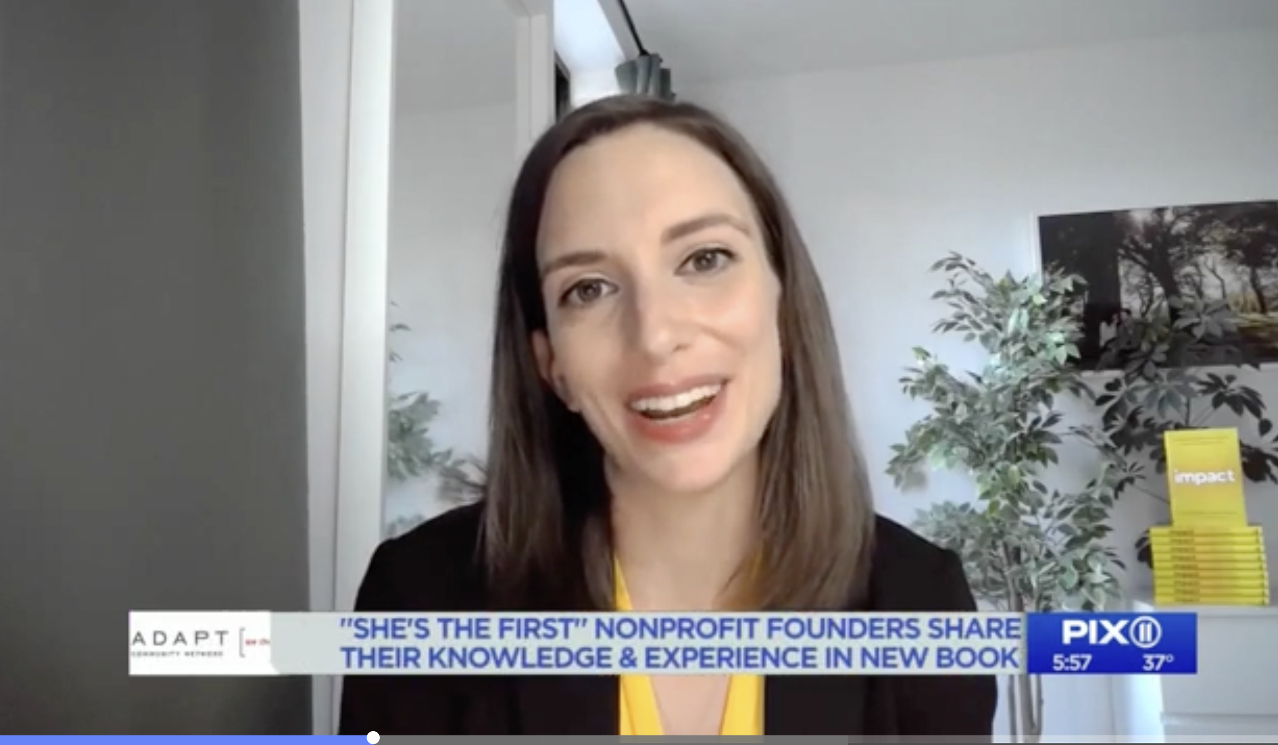 A woman smiling during a televised interview on PIX 11 news, with a banner at the bottom mentioning 'She’s the First' nonprofit founders sharing their knowledge and experience in a new book, with a timestamp of 5:57 and a temperature of 37°F.