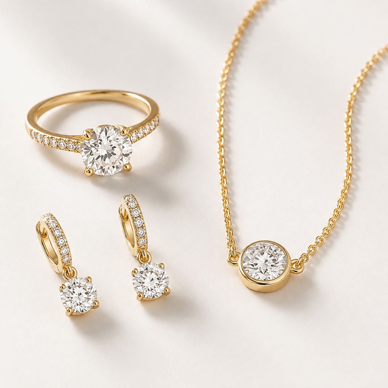 Gold jewelry set featuring large round diamonds, including a ring, earrings, and a necklace with matching pendant, all adorned with smaller diamonds.