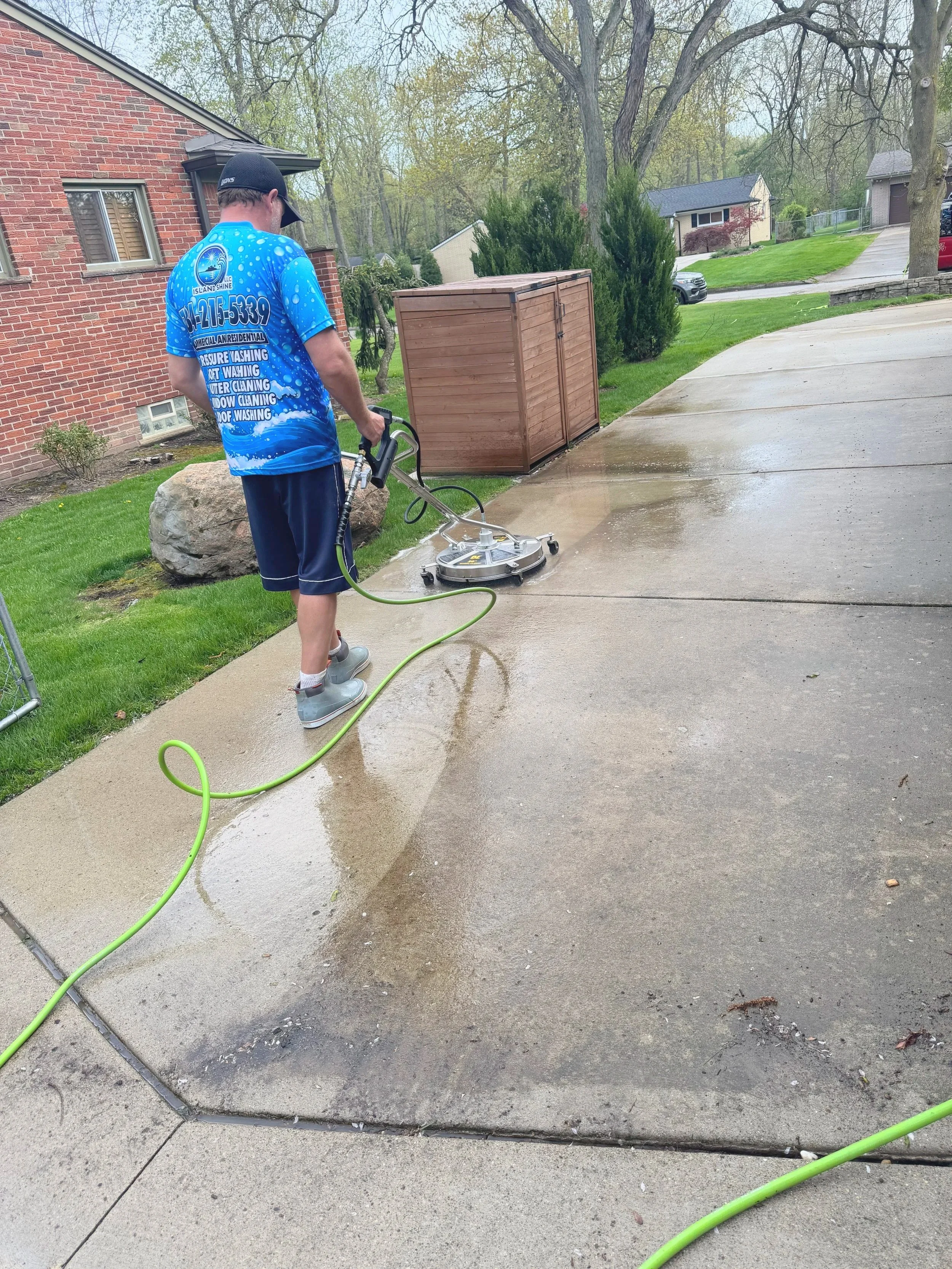 Dirty Concrete driveway cleaning process in Wayne County, MI | Island Shine