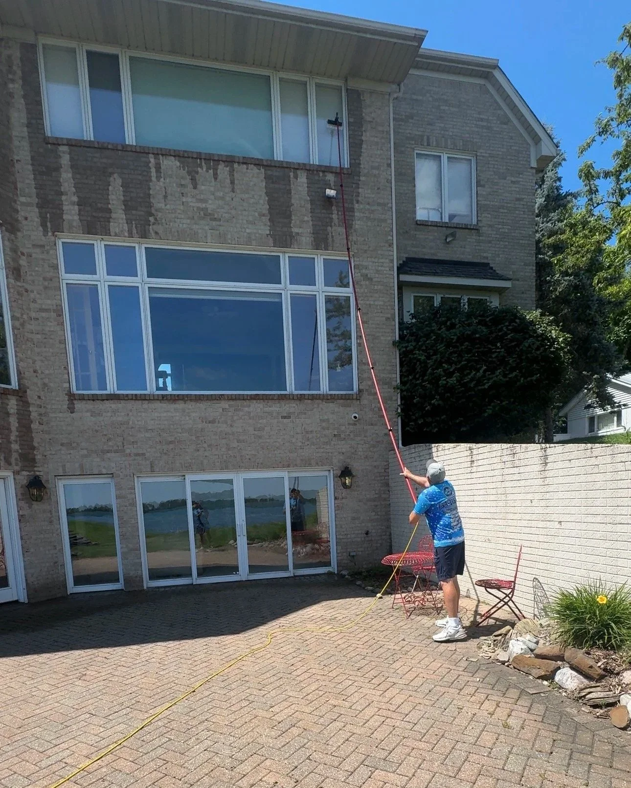 Pure water window cleaning with a water-fed pole on a home in Wayne County, MI | Island Shine