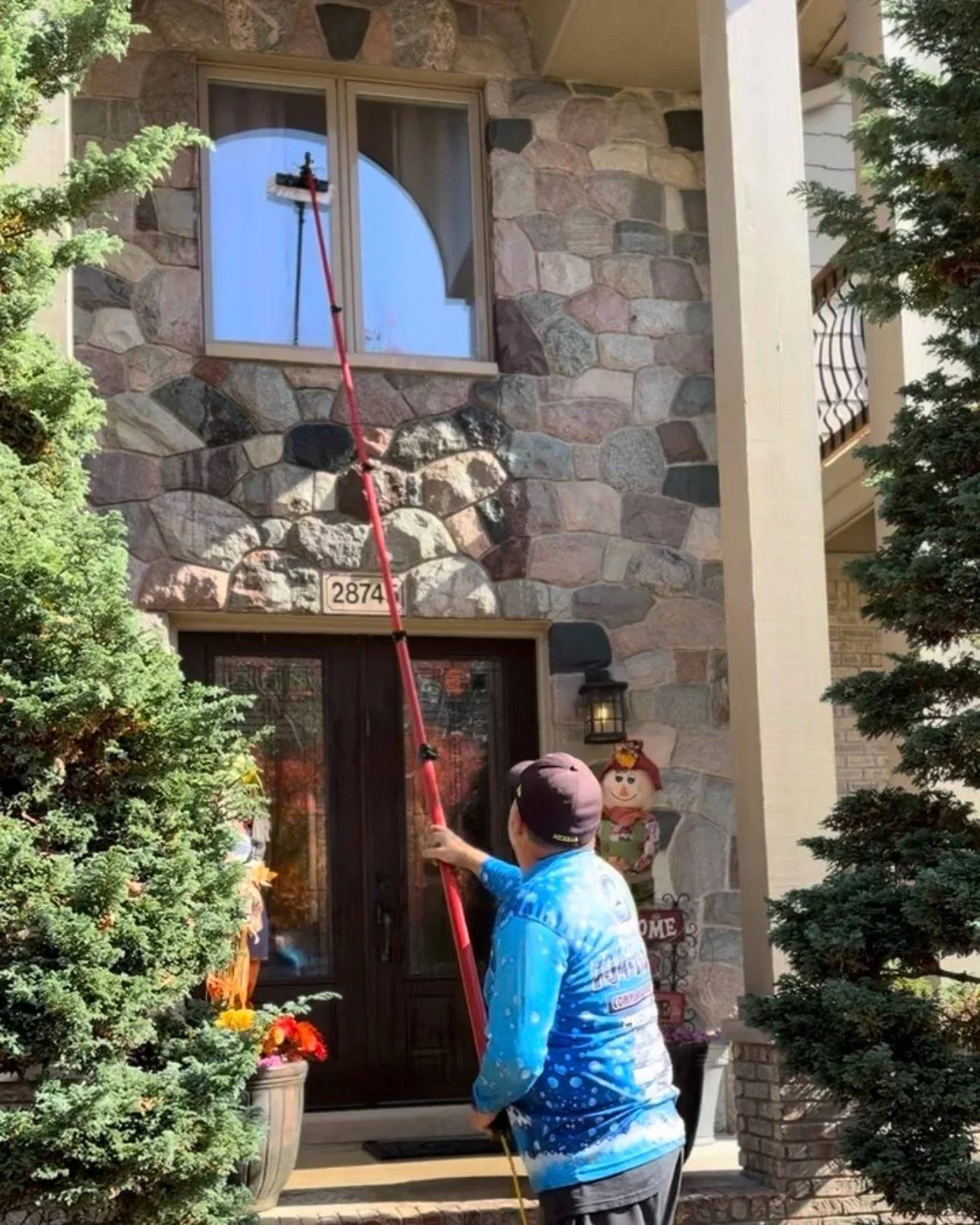 Water-fed pole exterior window cleaning in progress in Wayne County, MI | Island Shine