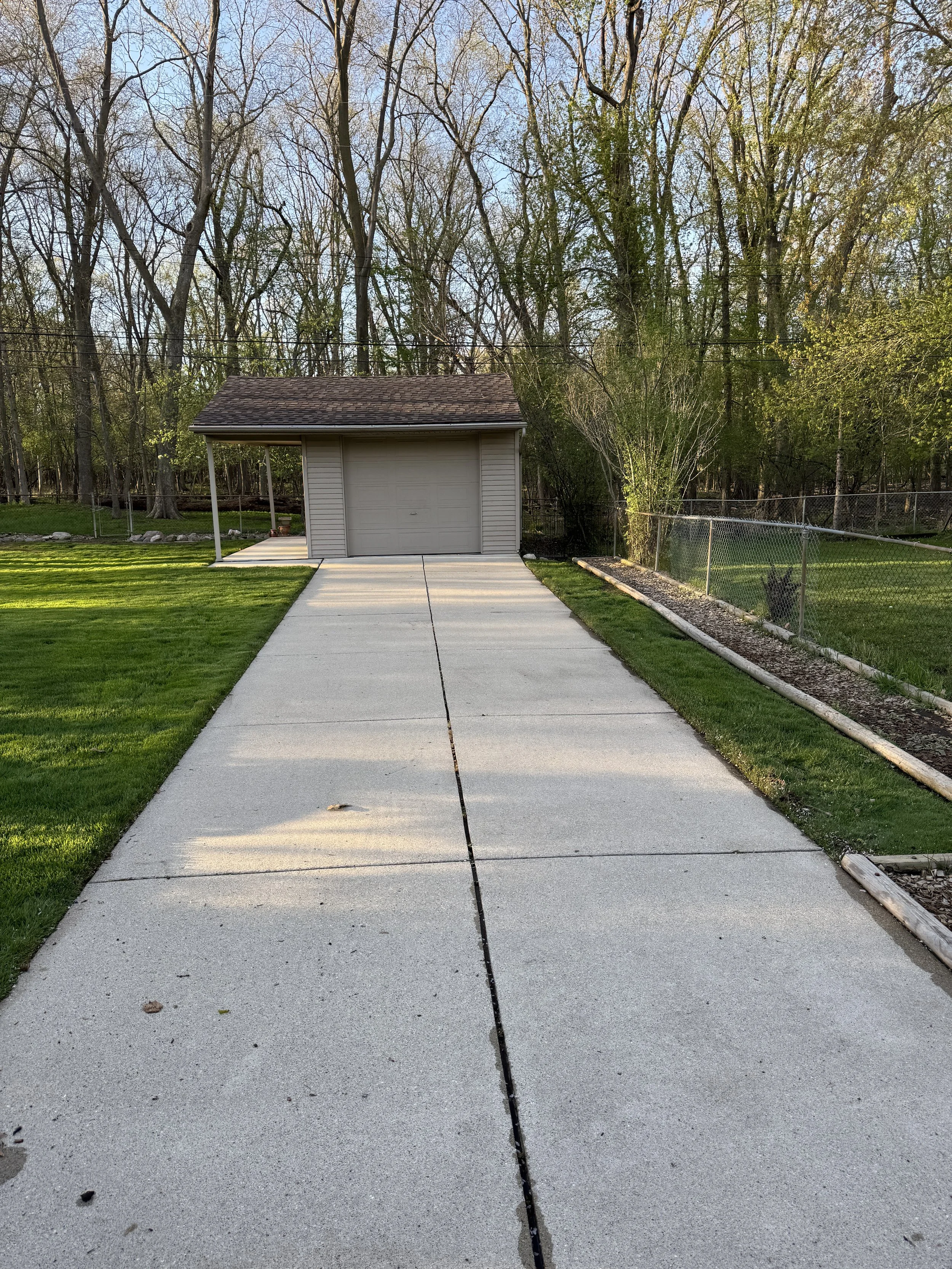 Concrete driveway after cleaning – wide view in Wayne County, MI | Island Shine