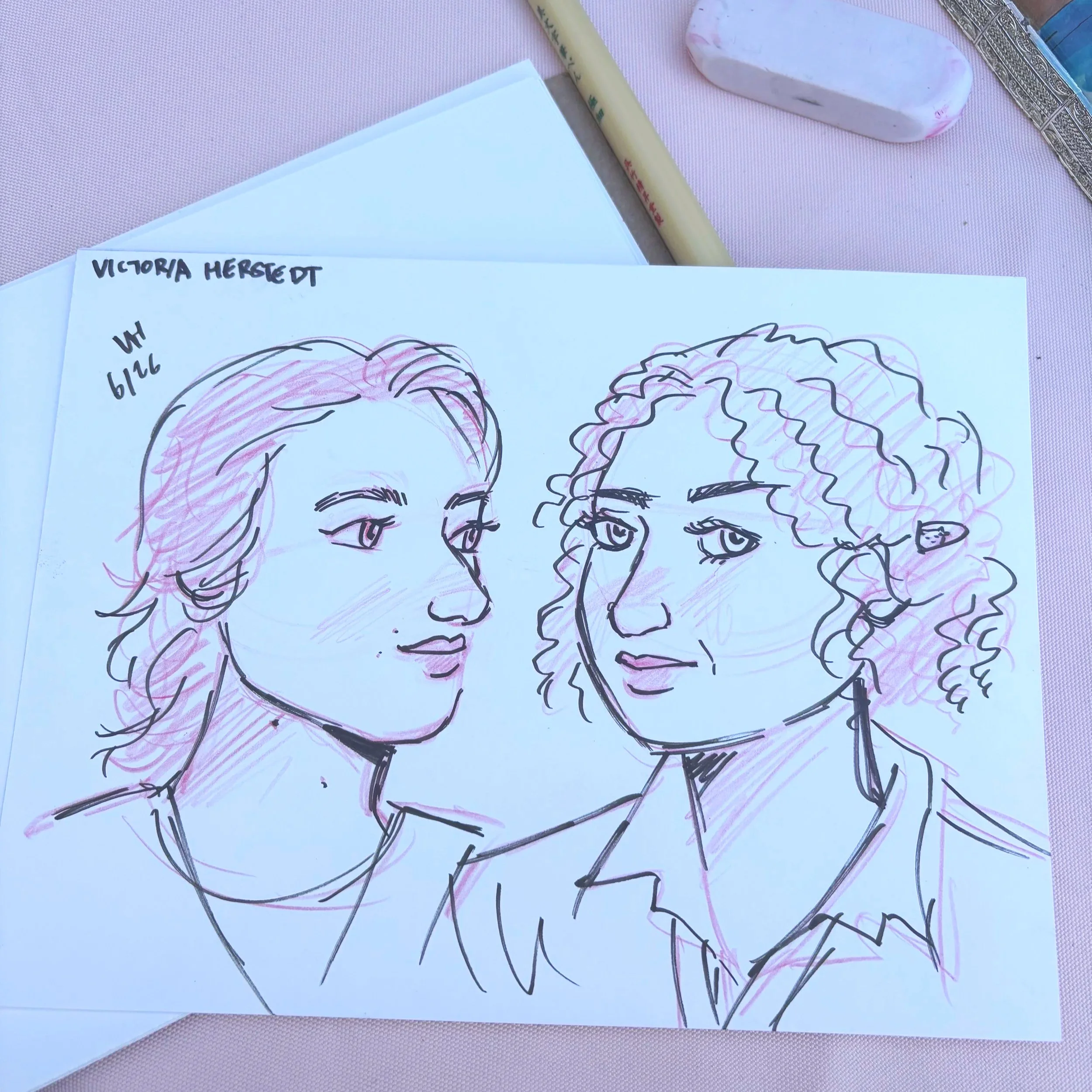 A black pen and red pencil live portrait illustration of two female guests a wedding.