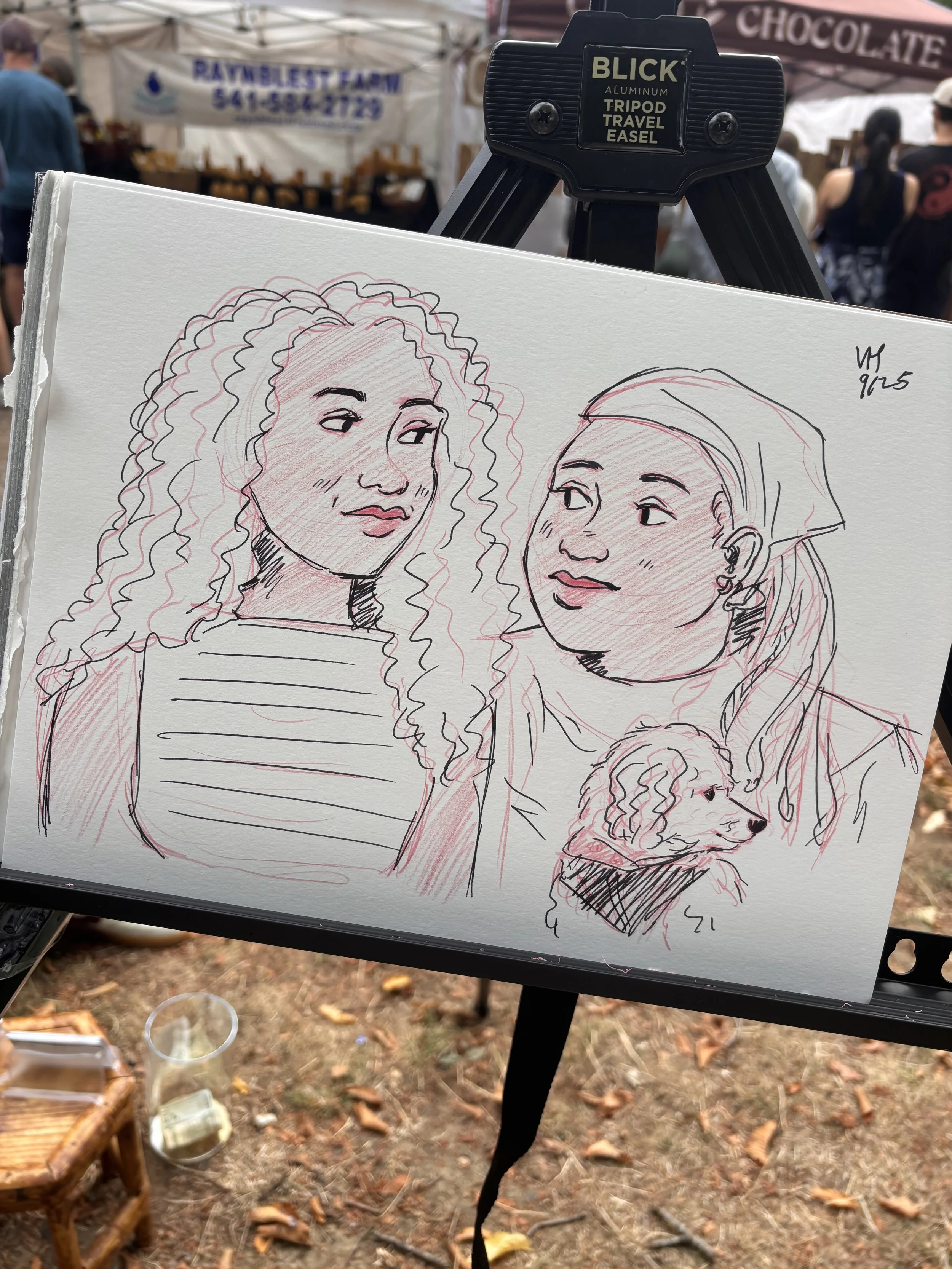 Two young women, lesbian couple, live portrait art. Dog portrait. Event drawing. LGBT WLW sapphic.
