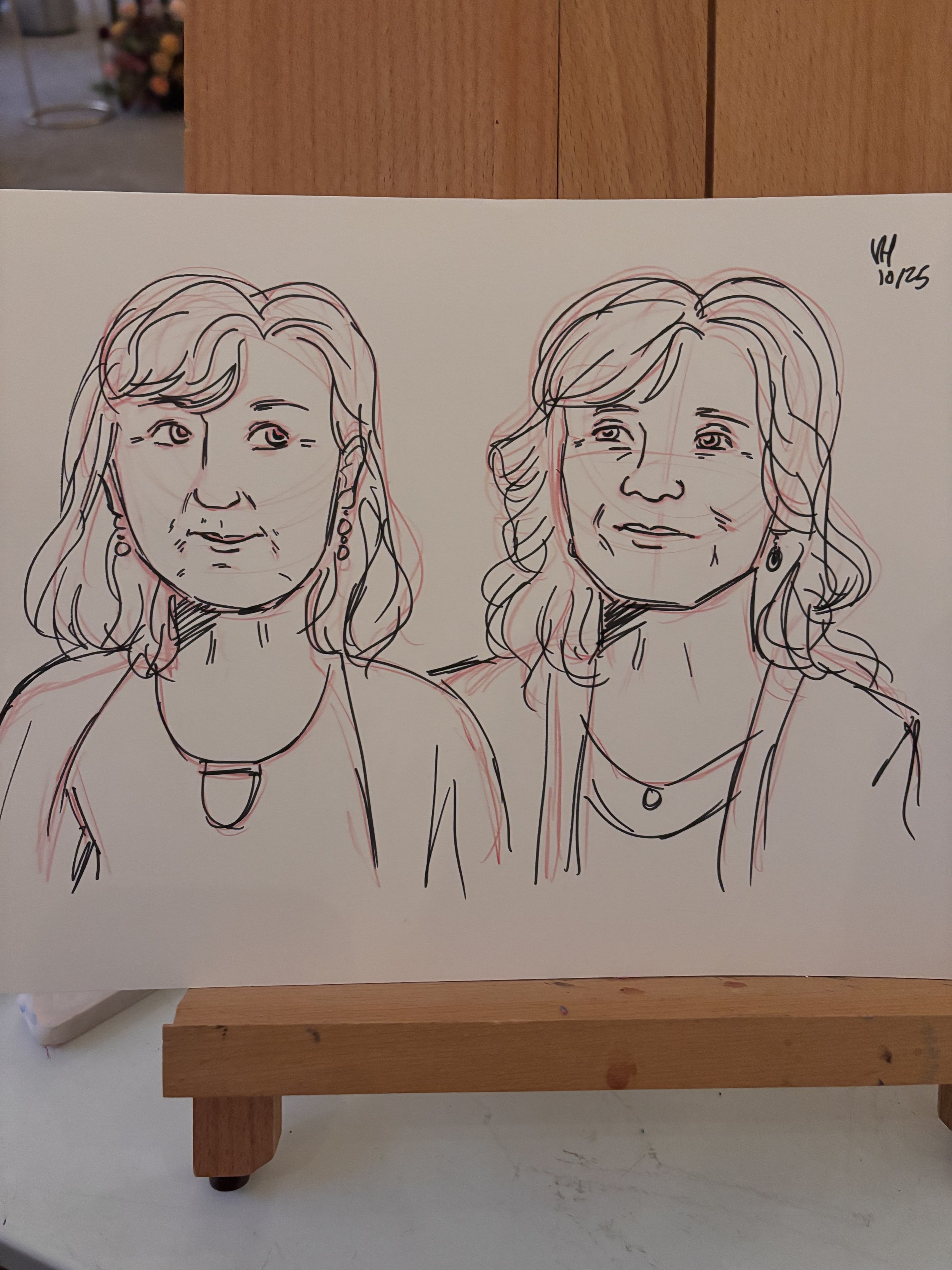 A pencil and ink marker sketch of two women at a wedding.