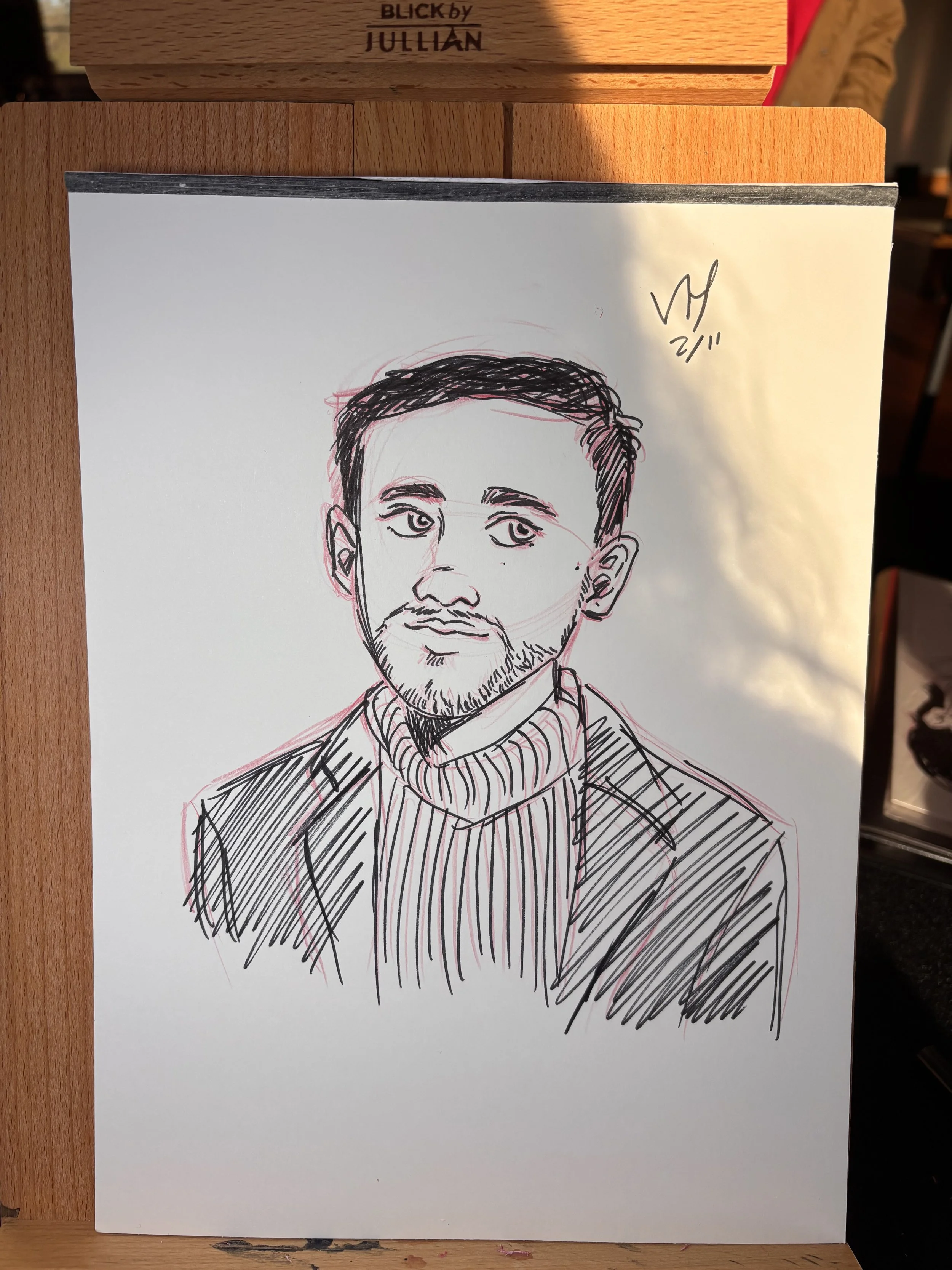 Ink and colored pencil drawing, live portrait art at a corporate event.