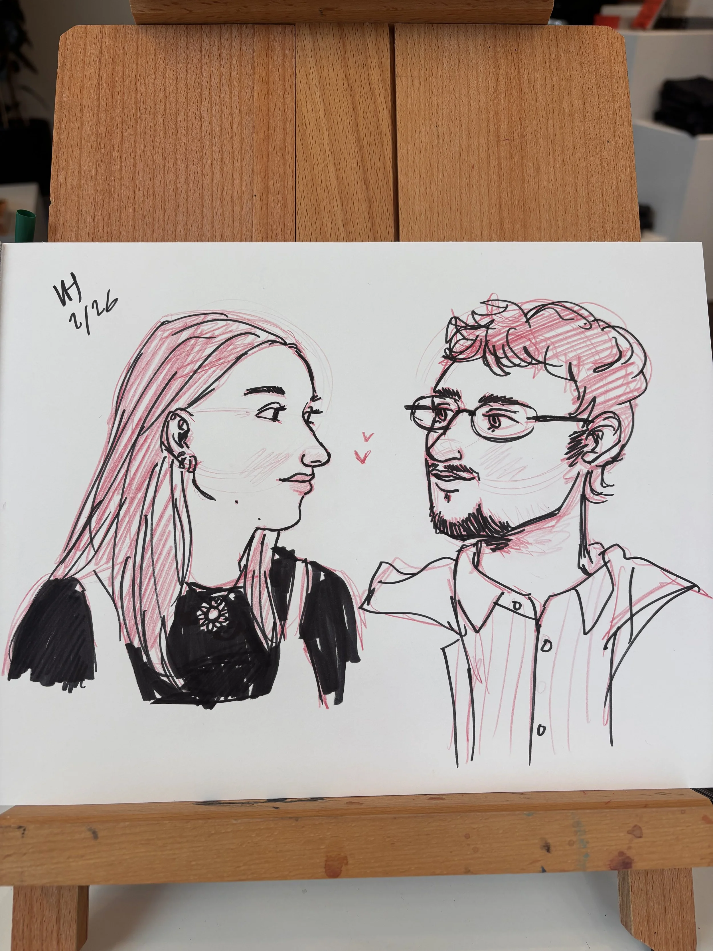 Drawing at a small business event, live portrait artist, pencil and ink art. Quick caricature sketch.