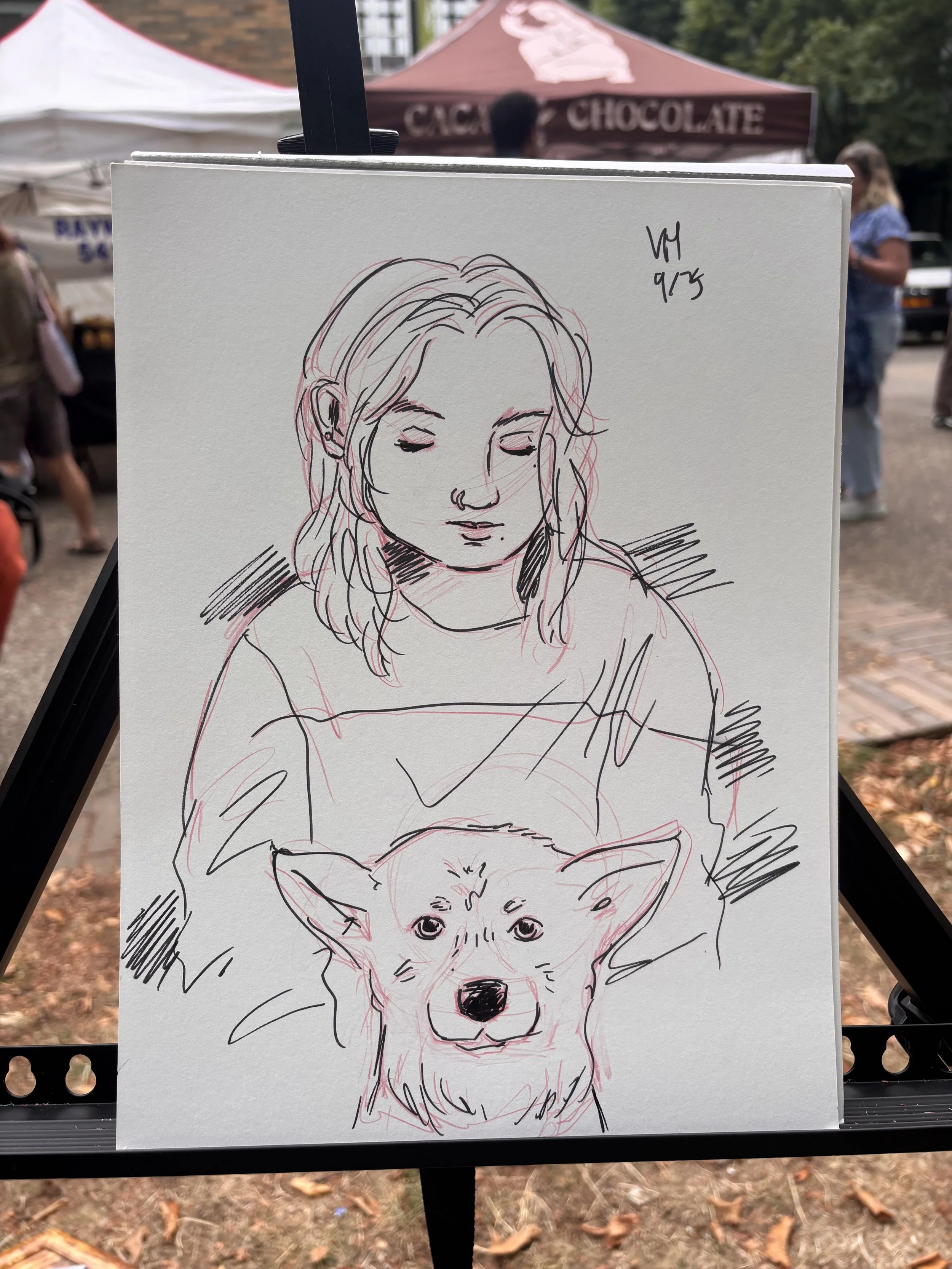 Pencil and ink sketch live portrait art of young woman and dog. Dogs. Animal art. Farmer's market event caricature.