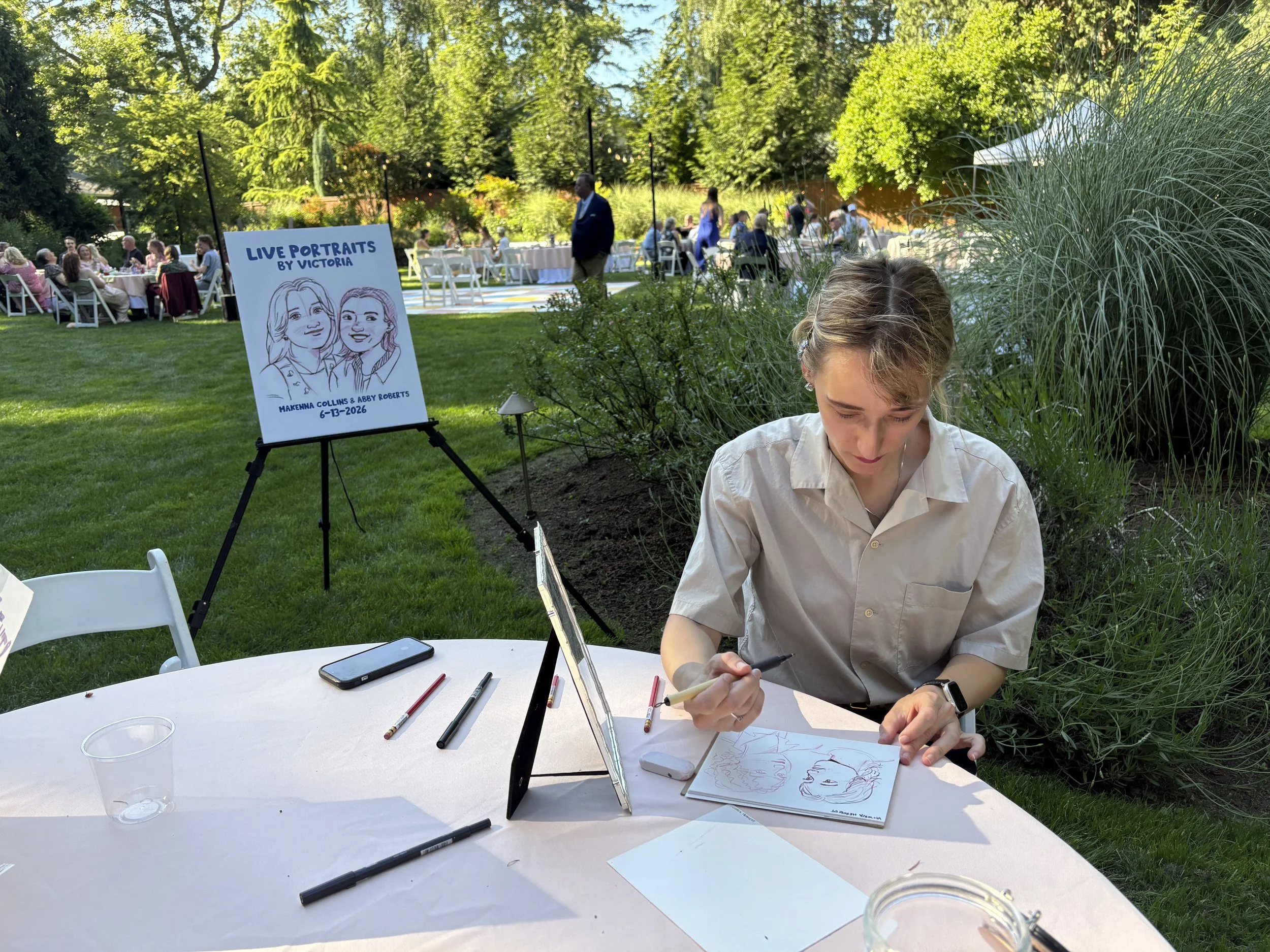 A live portrait artist working at a wedding at CedarVale events in Hubbard, Oregon.